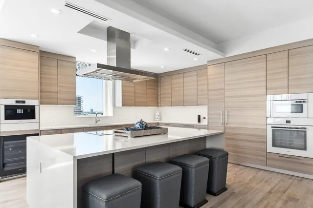 a kitchen with a sink cabinets and appliances