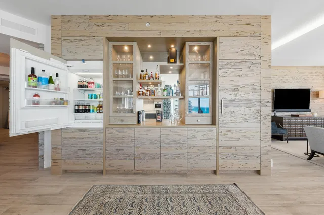 a view of living room with furniture and flat screen tv