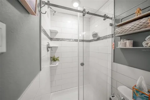 a bedroom with a bed dresser and a window