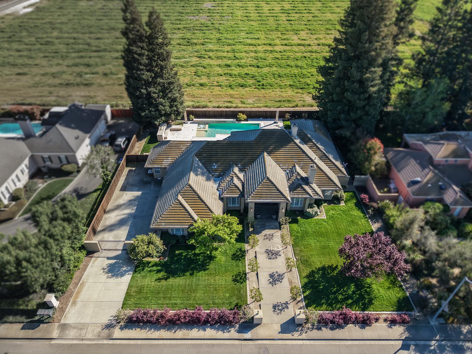 808 Country Club Drive Modesto, CA 95356 - Photo 14 of 60 an aerial view of multiple houses with a yard