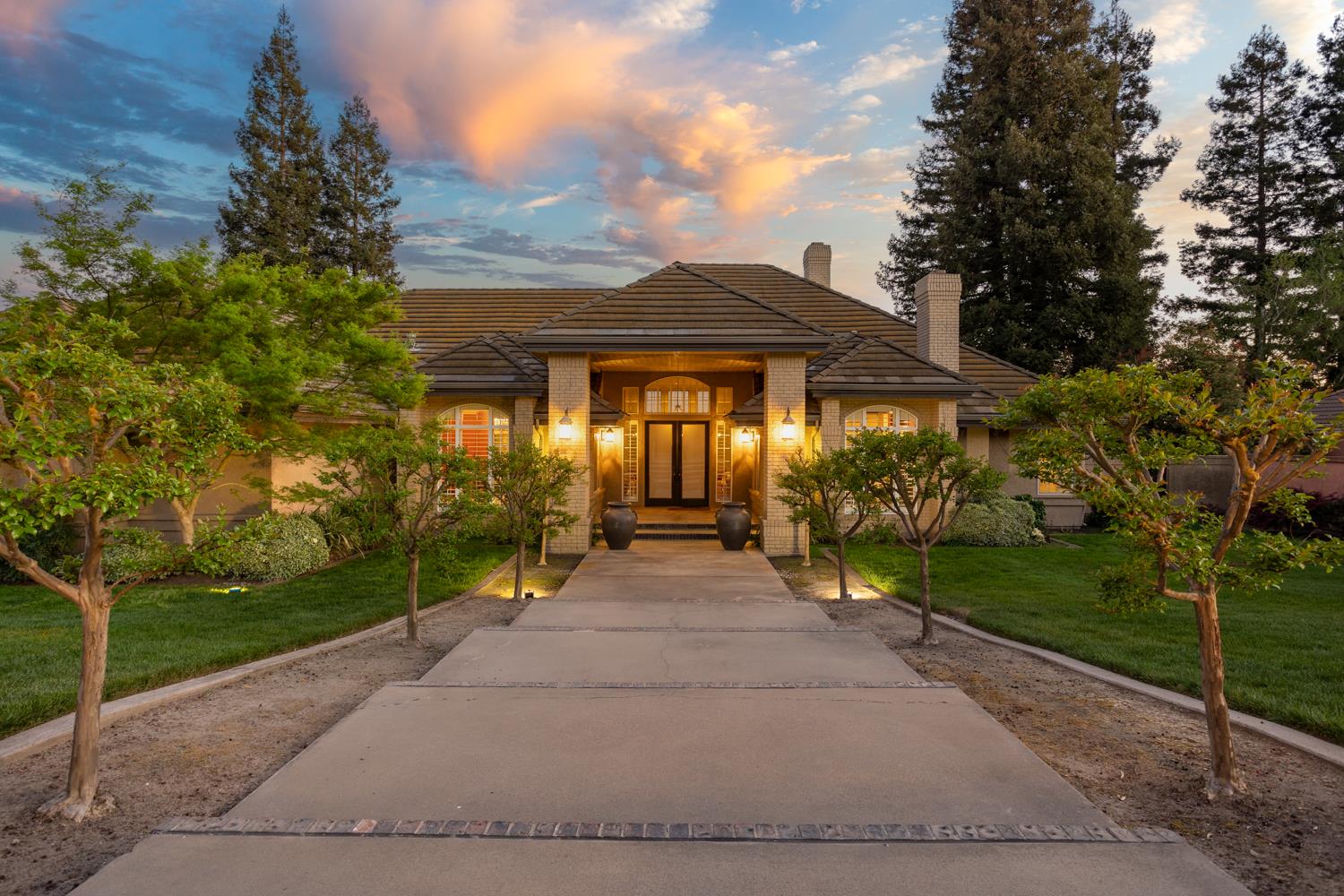 808 Country Club Drive Modesto, CA 95356 - Photo 2 of 60 a view of house in front of a yard with potted plants