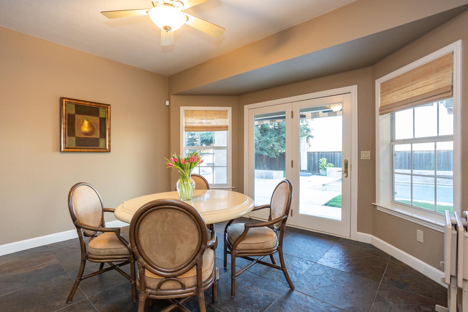 808 Country Club Drive Modesto, CA 95356 - Photo 30 of 60 a dining room with furniture a window and wooden floor