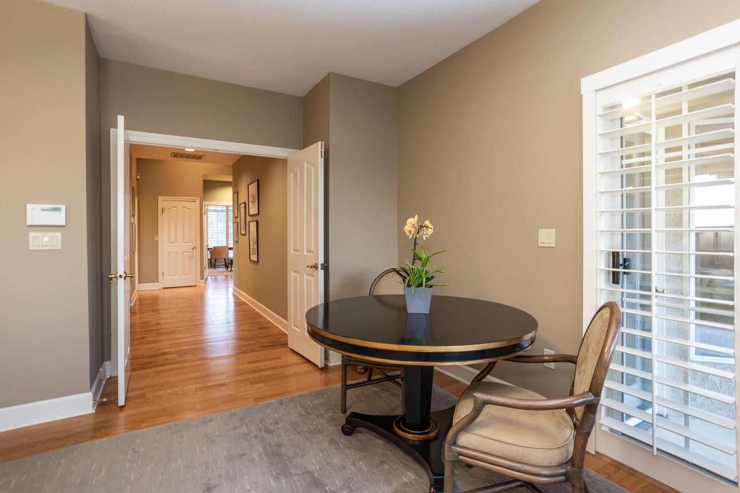 808 Country Club Drive Modesto, CA 95356 - Photo 37 of 60 a dining room with furniture and wooden floor