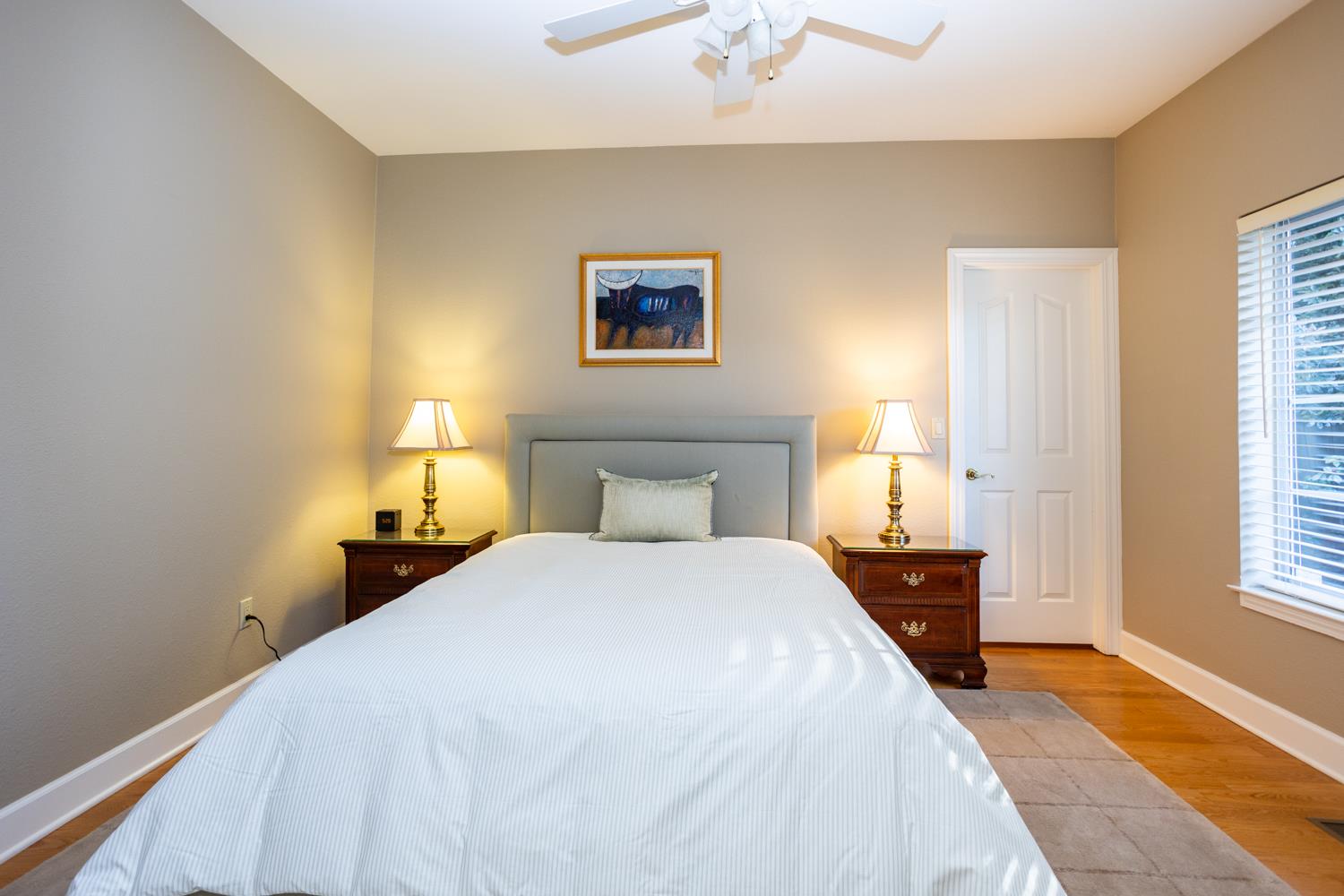808 Country Club Drive Modesto, CA 95356 - Photo 40 of 60 a bedroom with a bed and a chandelier