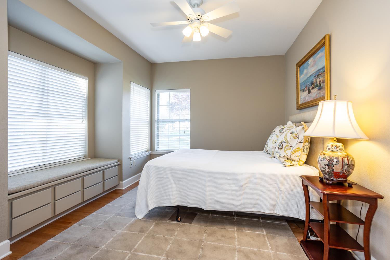 808 Country Club Drive Modesto, CA 95356 - Photo 41 of 60 a bedroom with a bed and a window with table