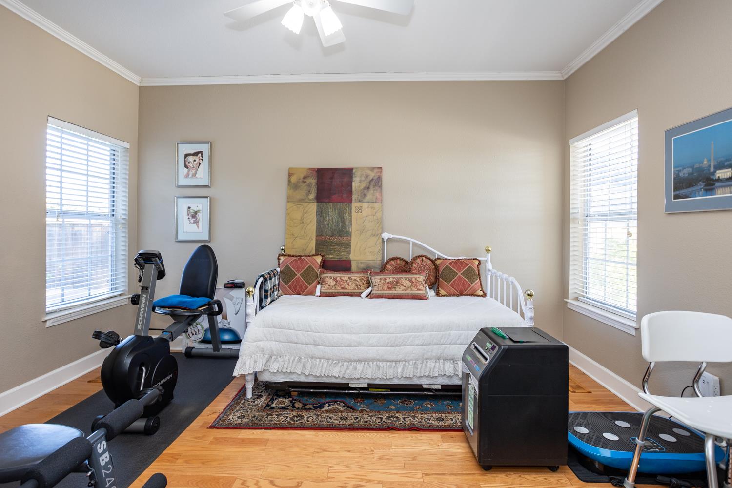 808 Country Club Drive Modesto, CA 95356 - Photo 43 of 60 a bedroom with a bed wooden floor and windows