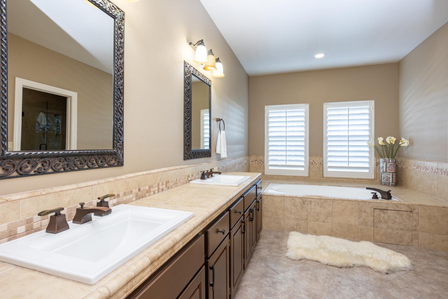 808 Country Club Drive Modesto, CA 95356 - Photo 44 of 60 a bathroom with a sink and a bathtub
