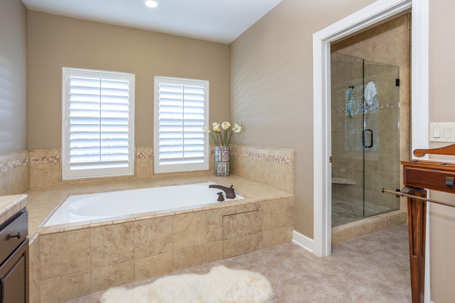 808 Country Club Drive Modesto, CA 95356 - Photo 45 of 60 a bathroom with a bathtub and a shower