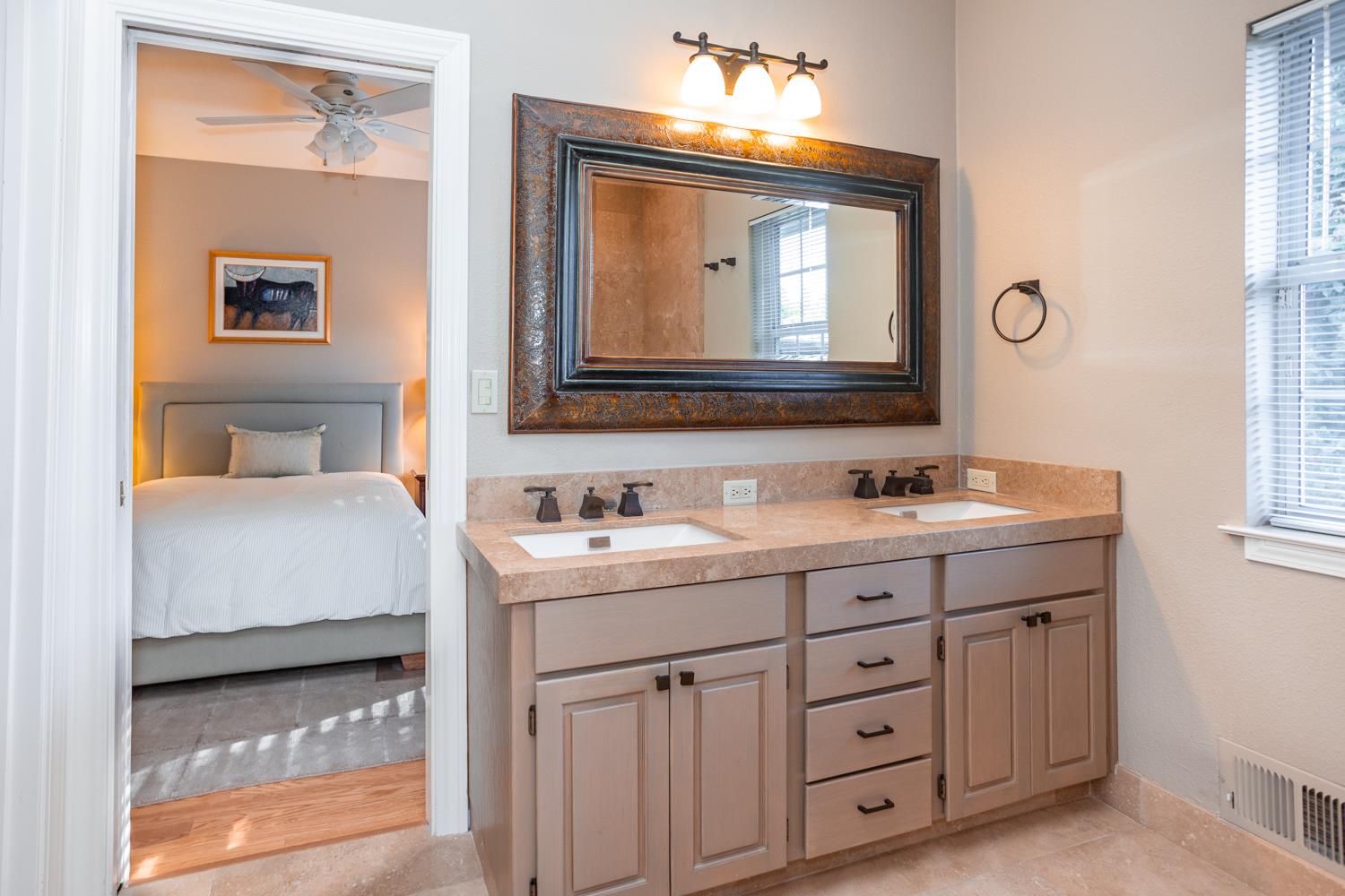 808 Country Club Drive Modesto, CA 95356 - Photo 48 of 60 a en suite bathroom with 2 sink tub and a mirror