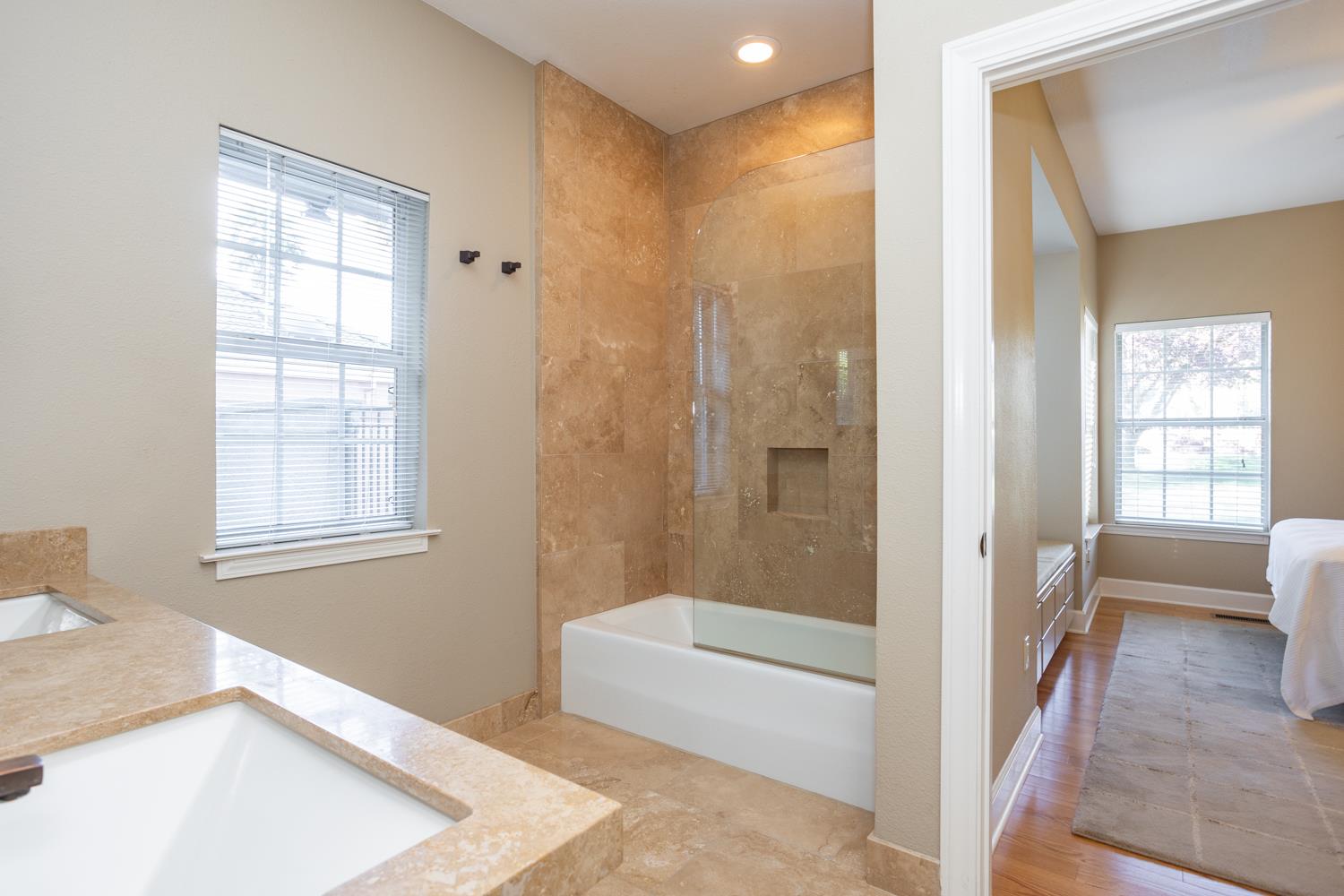 808 Country Club Drive Modesto, CA 95356 - Photo 49 of 60 a bathroom with a tub a sink and a window