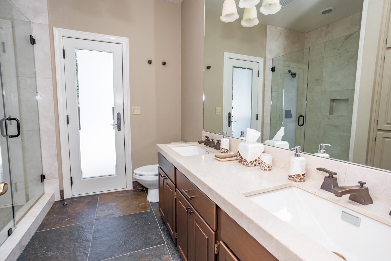 808 Country Club Drive Modesto, CA 95356 - Photo 50 of 60 a bathroom with a sink a toilet and shower