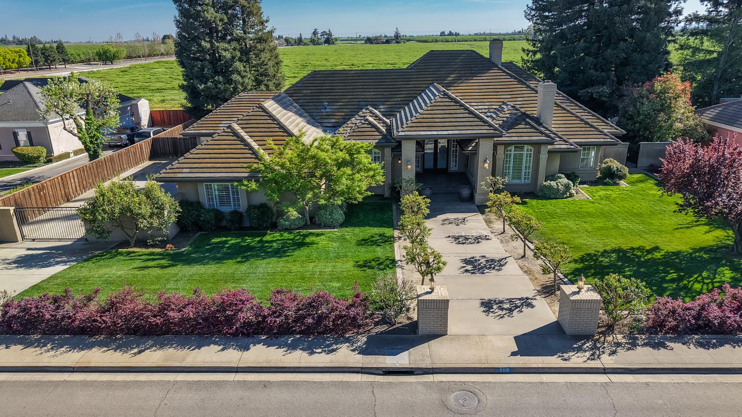 808 Country Club Drive Modesto, CA 95356 - Photo 57 of 60 a front view of a house with a garden
