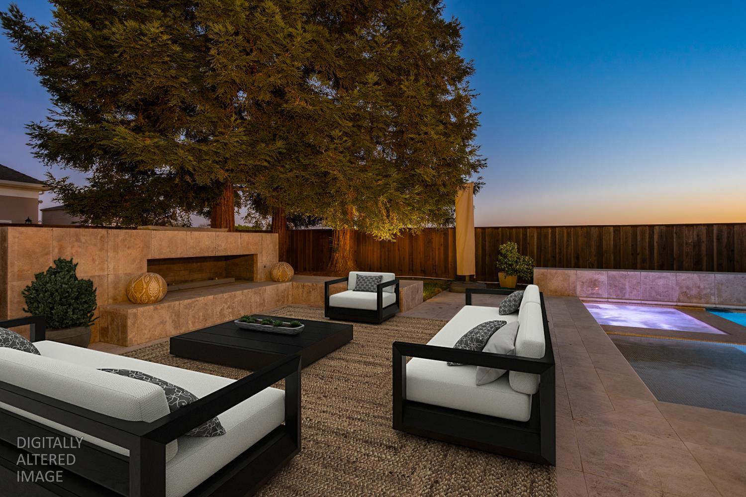 808 Country Club Drive Modesto, CA 95356 - Photo 8 of 60 a view of a patio with couches a table and chairs with wooden fence