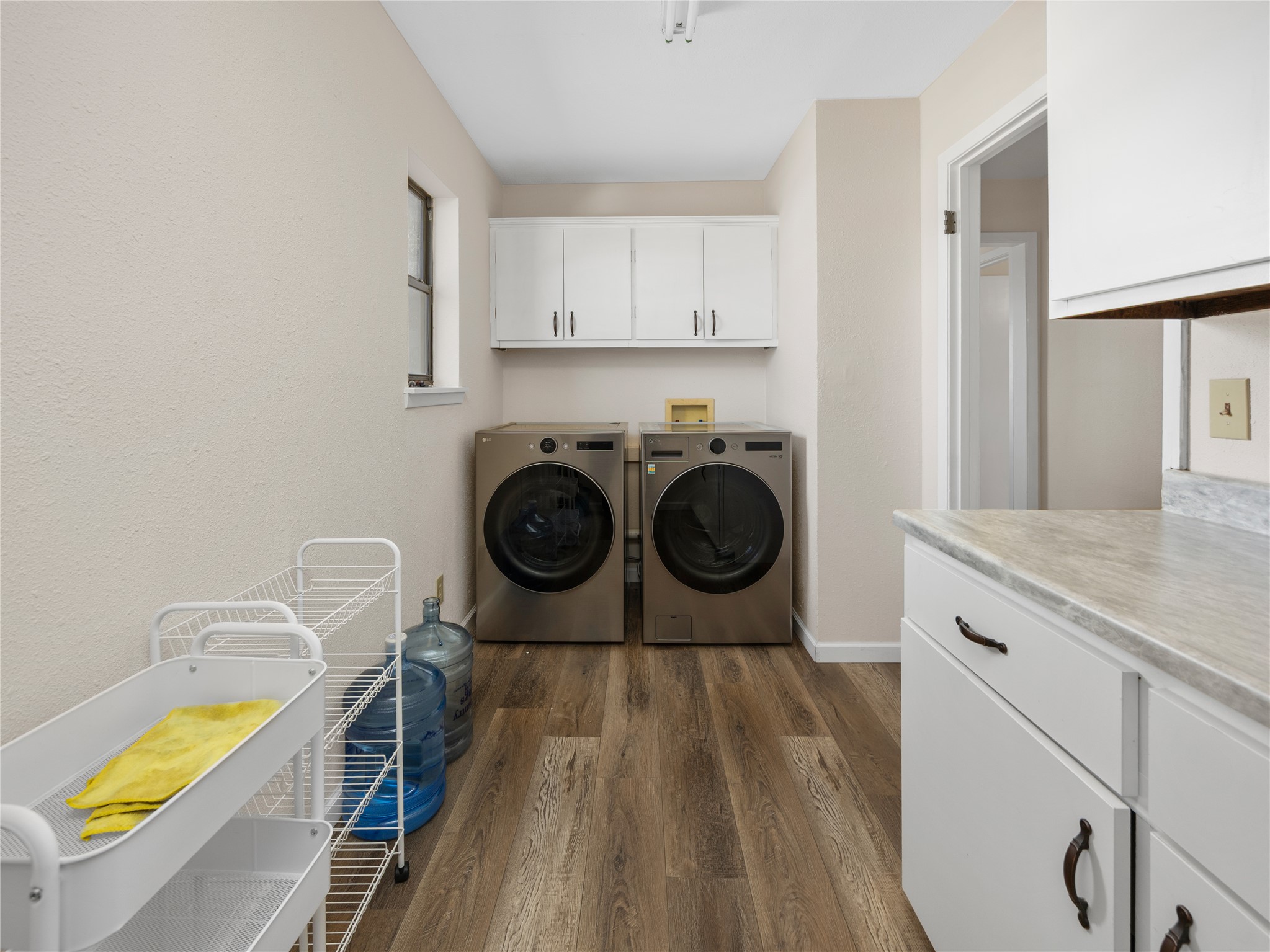 2412 Williamson Road Lockhart, TX 78644 - Photo 26 of 36 Laundry area with wood-finish flooring