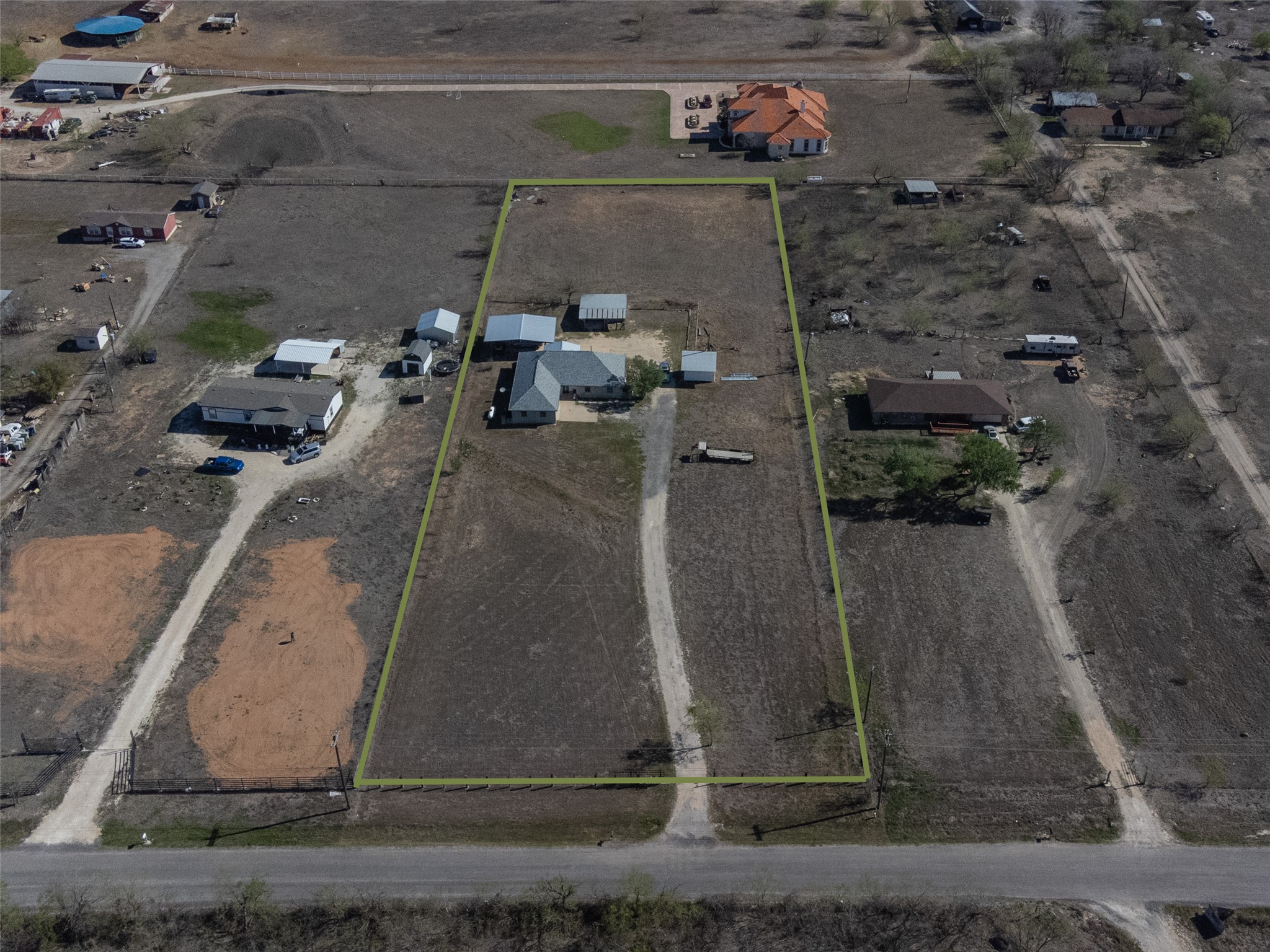 2412 Williamson Road Lockhart, TX 78644 - Photo 34 of 36 Expansive parcel featuring a main residence, multiple auxiliary structures, and undeveloped land