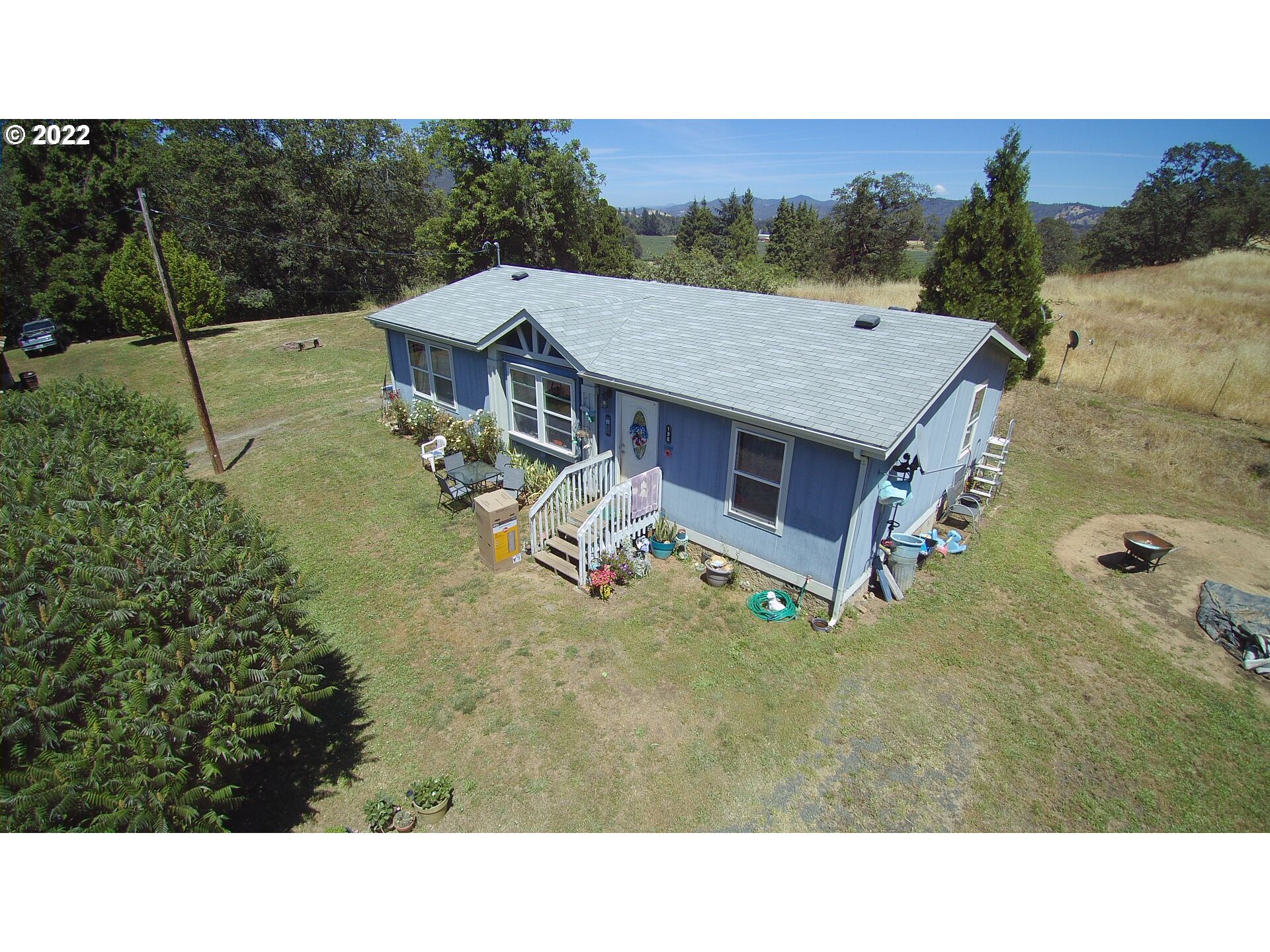 198 Council Creek Road Riddle, OR 97469 - Photo 19 of 24 a view of a house with a yard