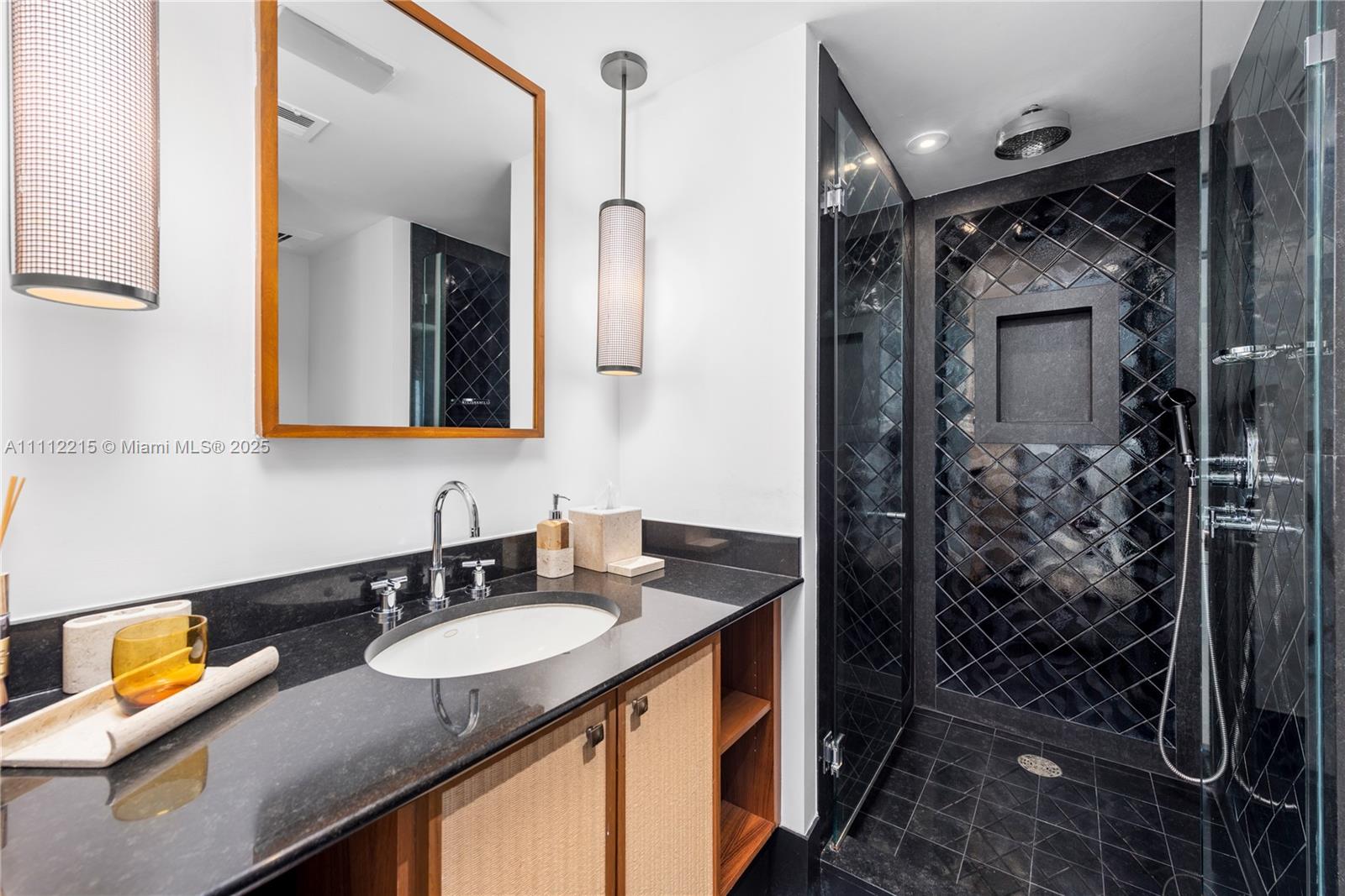 101 20th Street, Unit 2401 Miami Beach, FL 33139 - Photo 14 of 29 a bathroom with a granite countertop sink and a mirror