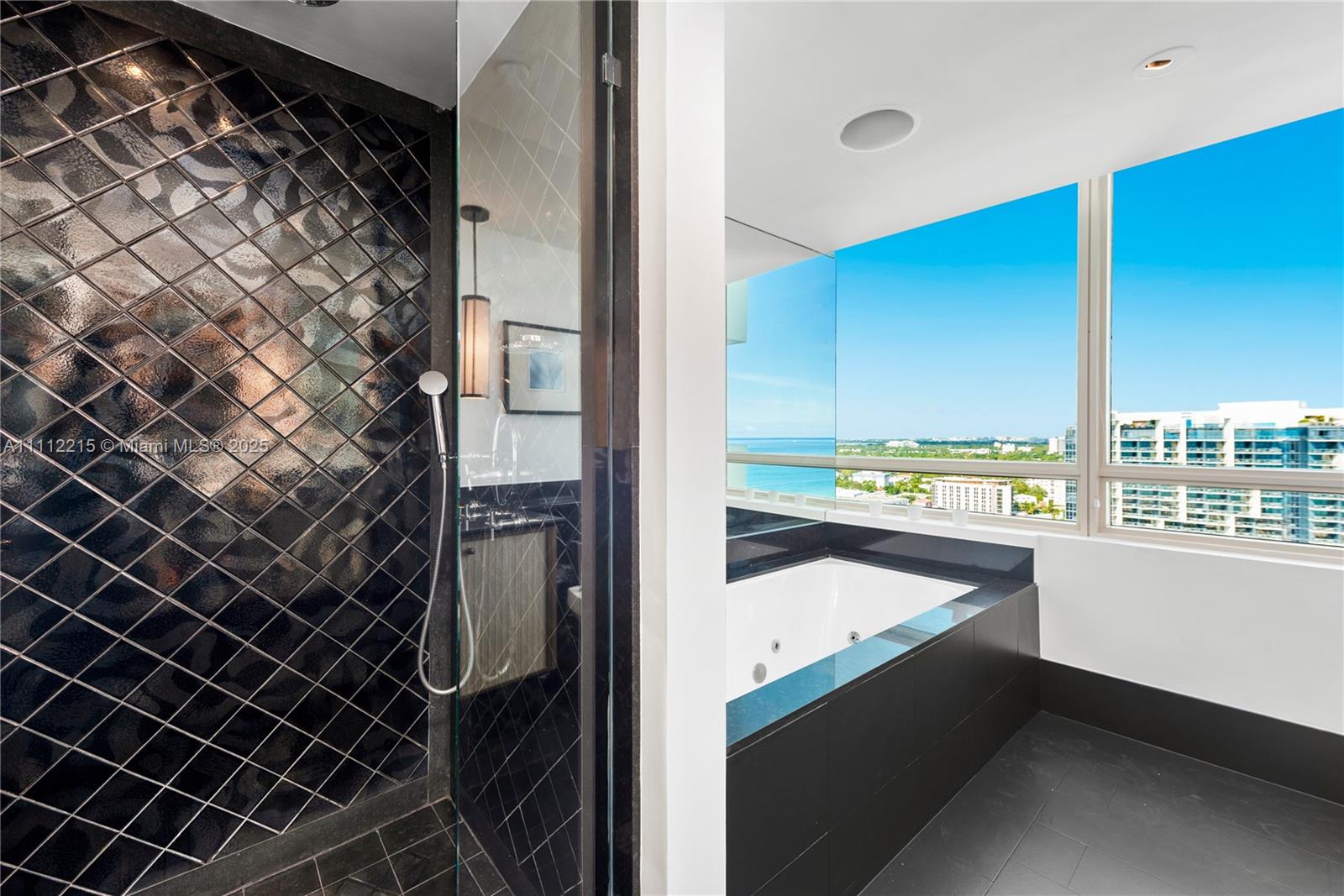 101 20th Street, Unit 2401 Miami Beach, FL 33139 - Photo 17 of 29 a view of a room with wooden floor and windows