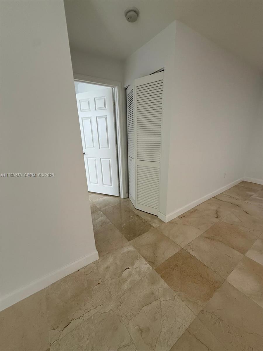 8390 Southwest 72nd Avenue, Unit 520 Miami, FL 33143 - Photo 25 of 61 an empty room with windows