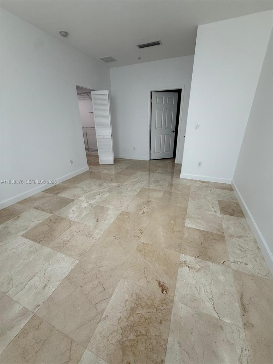 8390 Southwest 72nd Avenue, Unit 520 Miami, FL 33143 - Photo 35 of 61 an empty room with a natural light