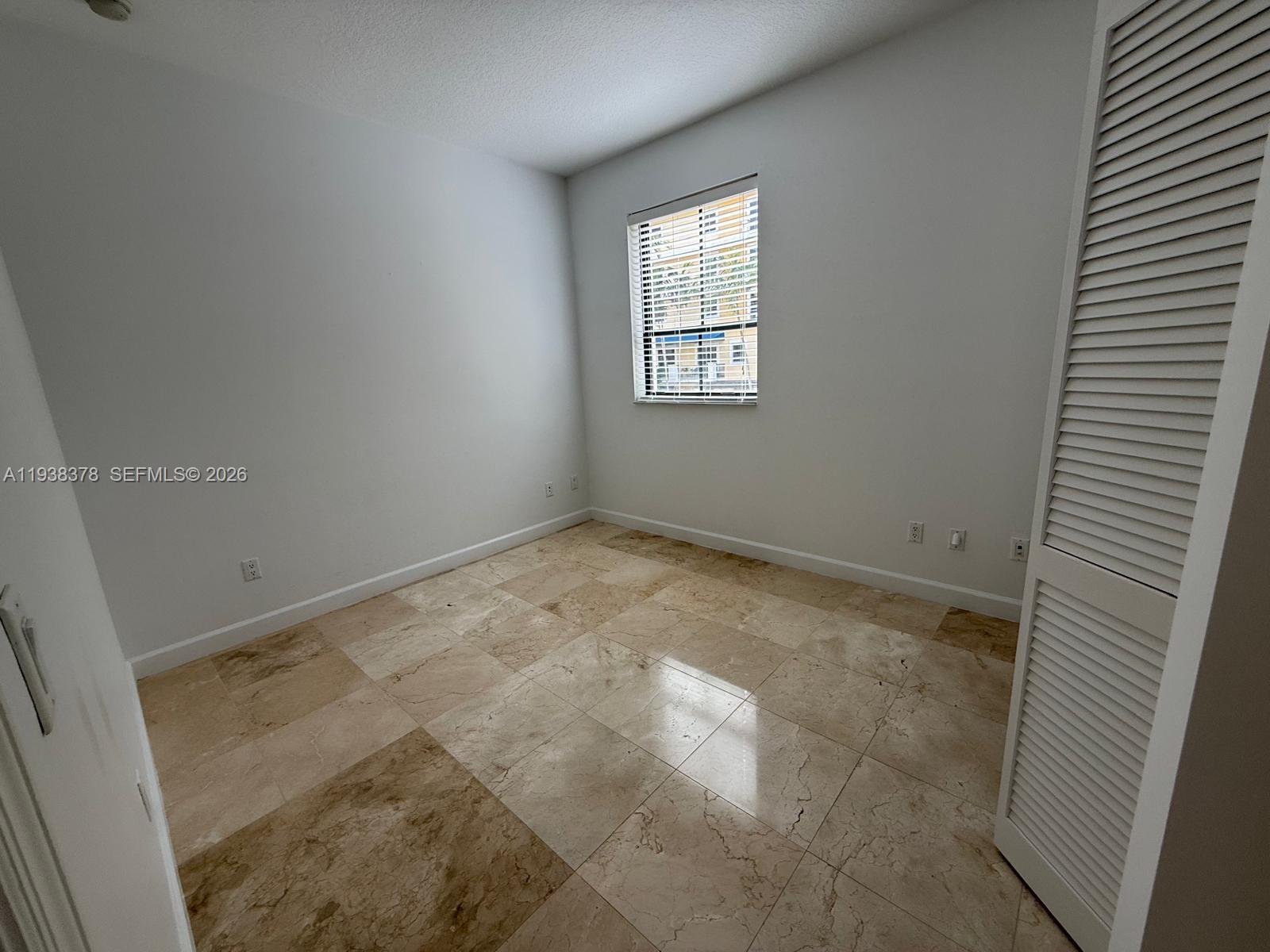 8390 Southwest 72nd Avenue, Unit 520 Miami, FL 33143 - Photo 37 of 61 an empty room with windows