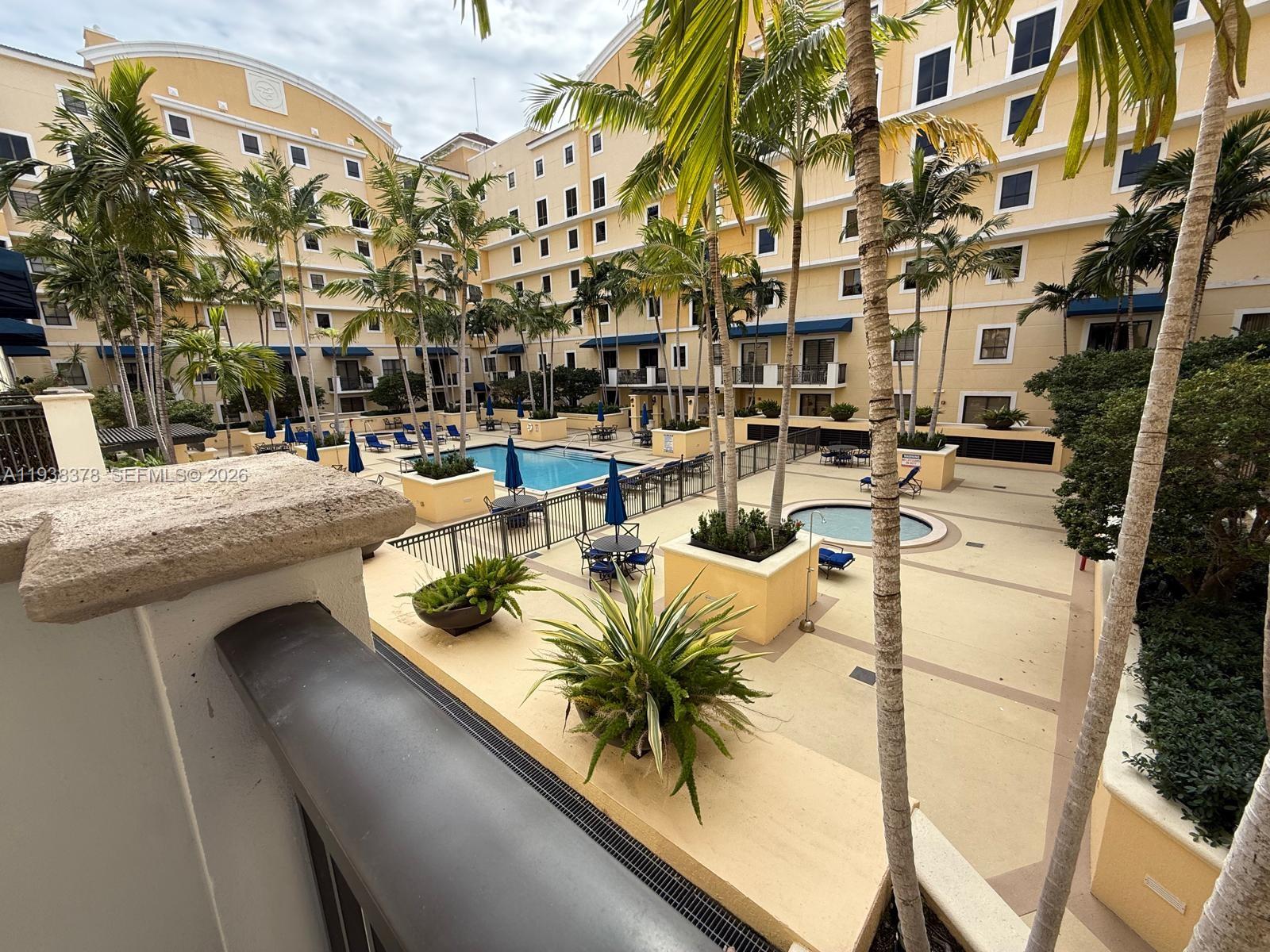 8390 Southwest 72nd Avenue, Unit 520 Miami, FL 33143 - Photo 43 of 61 a view of a chairs and table in patio