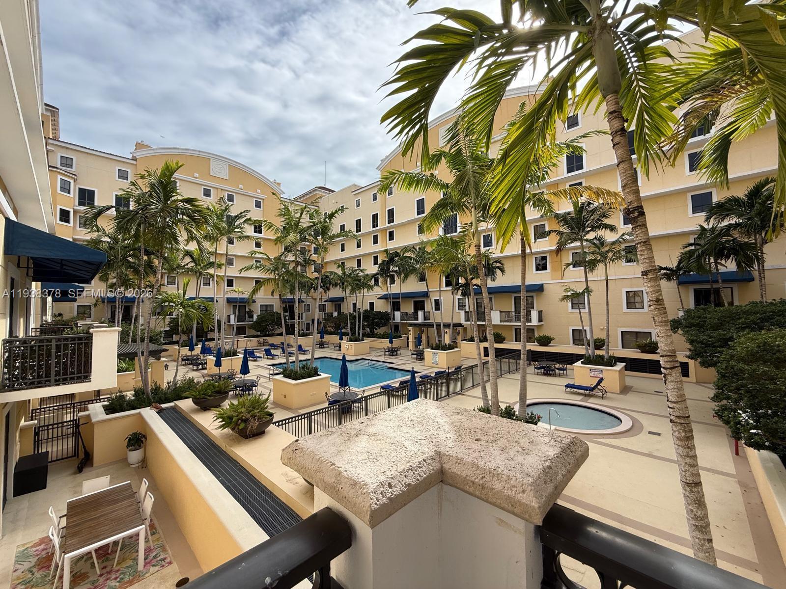 8390 Southwest 72nd Avenue, Unit 520 Miami, FL 33143 - Photo 45 of 61 a view of a tall building from a patio