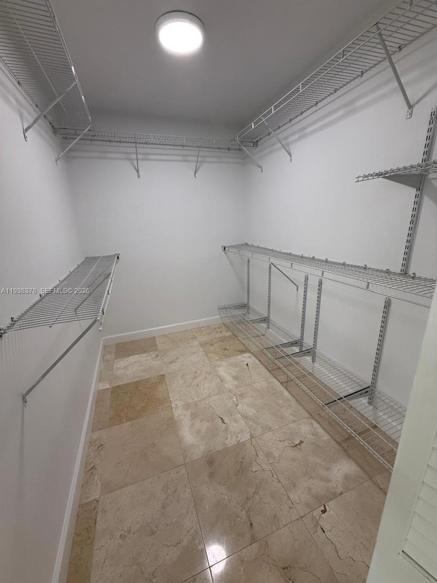 8390 Southwest 72nd Avenue, Unit 520 Miami, FL 33143 - Photo 46 of 61 a view of a room with racks on the wall