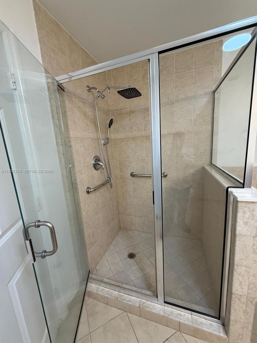 8390 Southwest 72nd Avenue, Unit 520 Miami, FL 33143 - Photo 51 of 61 a bathroom with a shower