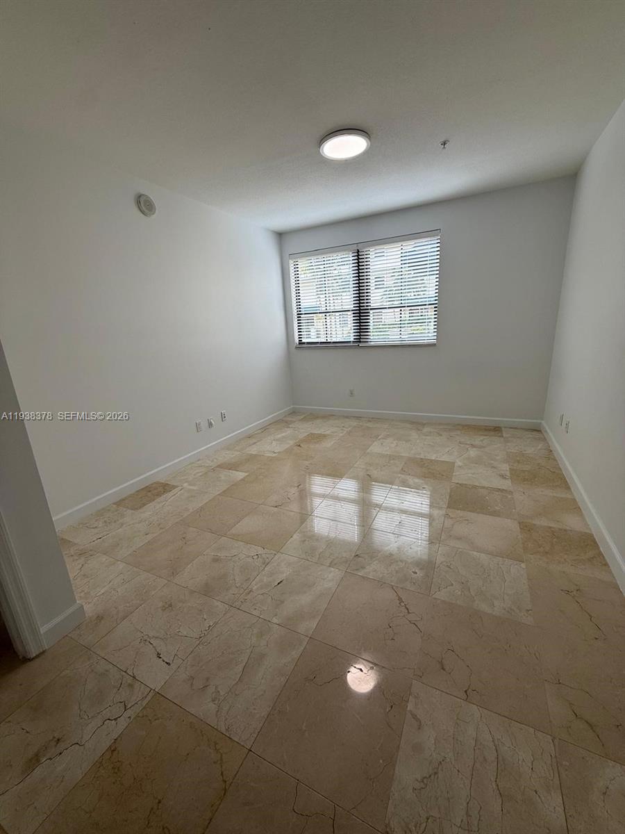 8390 Southwest 72nd Avenue, Unit 520 Miami, FL 33143 - Photo 52 of 61 an empty room with windows
