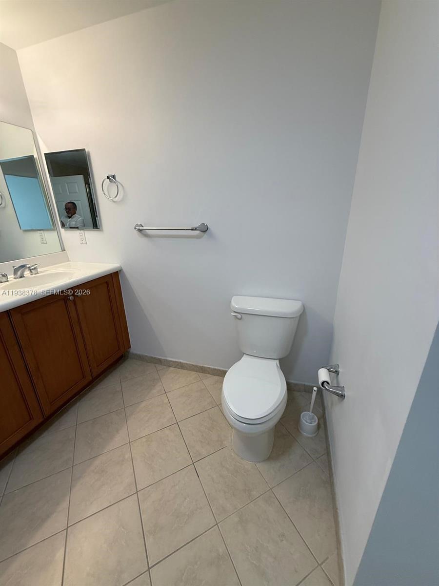 8390 Southwest 72nd Avenue, Unit 520 Miami, FL 33143 - Photo 56 of 61 a bathroom with a toilet and a sink