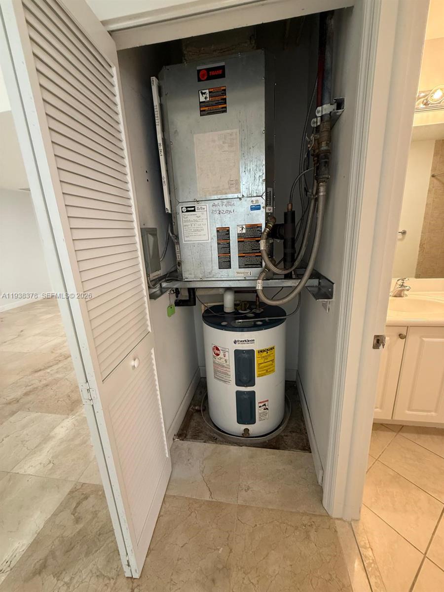 8390 Southwest 72nd Avenue, Unit 520 Miami, FL 33143 - Photo 58 of 61 a utility room with dryer and washer