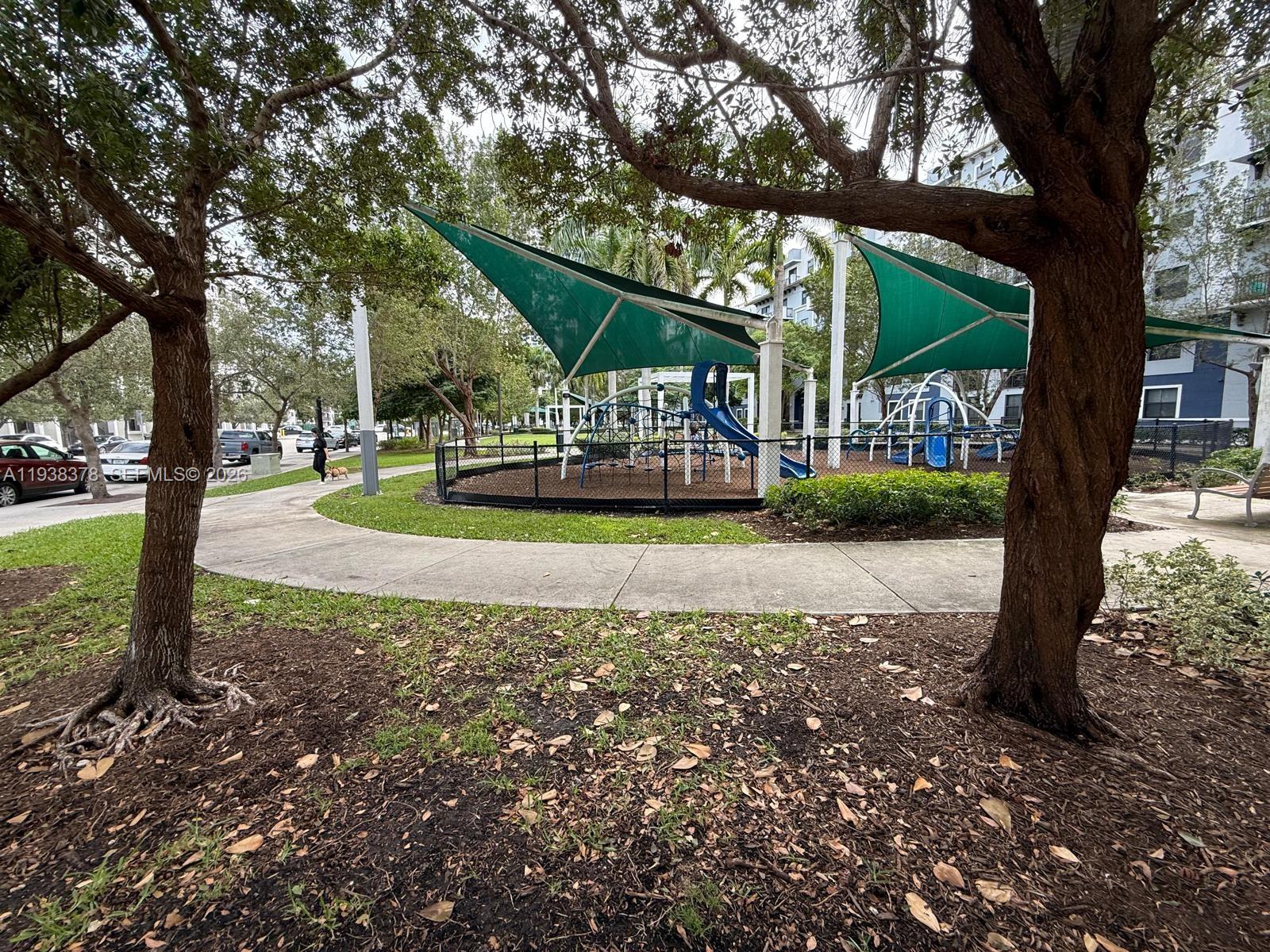 8390 Southwest 72nd Avenue, Unit 520 Miami, FL 33143 - Photo 8 of 61 a view of a house with a yard