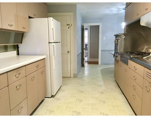 254 Green River Road Greenfield, MA 01301 - Photo 16 of 31 a kitchen with white cabinets and refrigerator