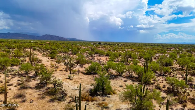 a view of an outdoor space and mountain from inside of a city