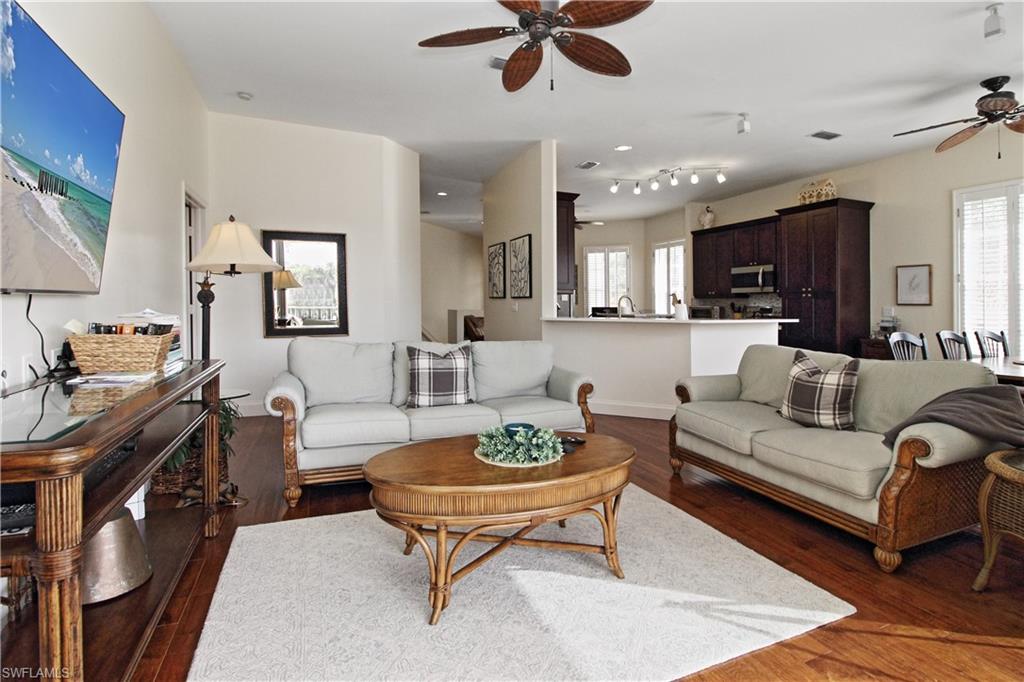 970 Egrets Run, Unit 201 Naples, FL 34108 - Photo 15 of 50 a view of a livingroom with furniture and a table