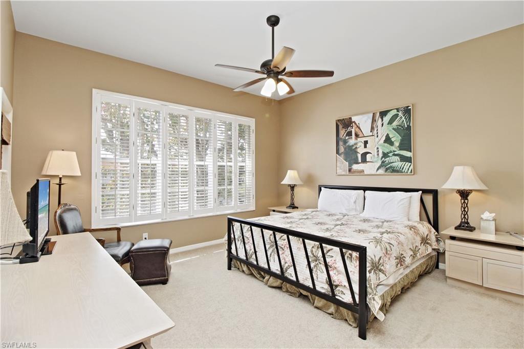 970 Egrets Run, Unit 201 Naples, FL 34108 - Photo 16 of 50 a bed room with a bed and a window