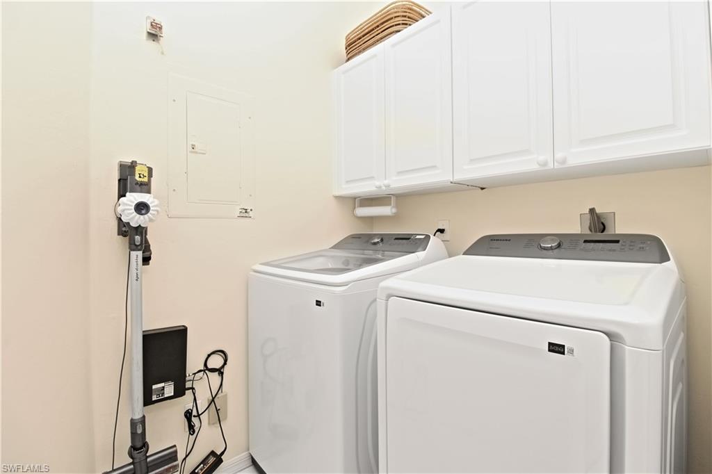 970 Egrets Run, Unit 201 Naples, FL 34108 - Photo 24 of 50 a utility room with dryer and washer