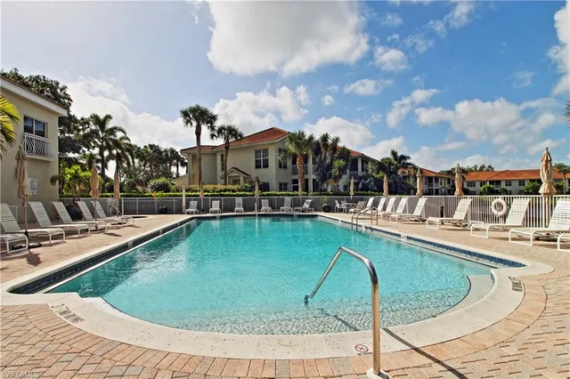 a view of a swimming pool with a patio