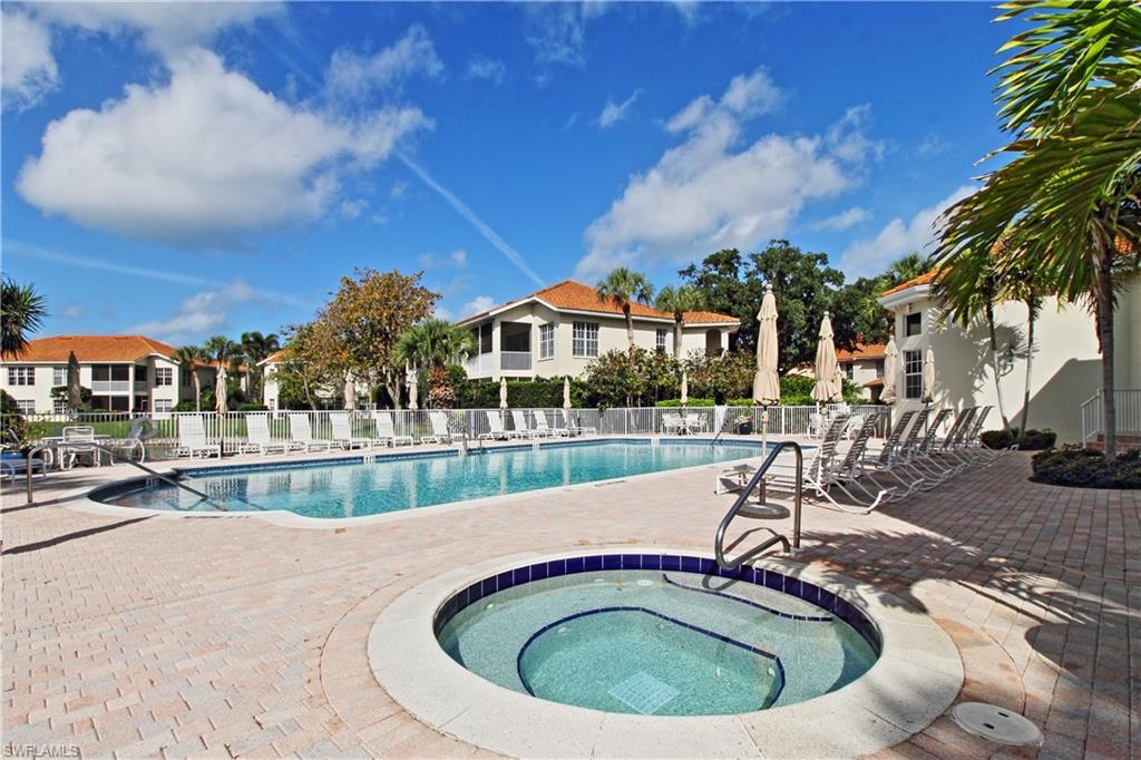 970 Egrets Run, Unit 201 Naples, FL 34108 - Photo 27 of 50 a view of a swimming pool with a patio