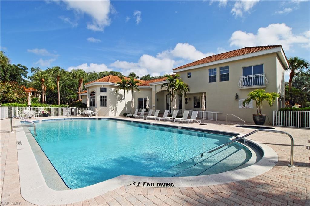 970 Egrets Run, Unit 201 Naples, FL 34108 - Photo 28 of 50 a view of a house with swimming pool