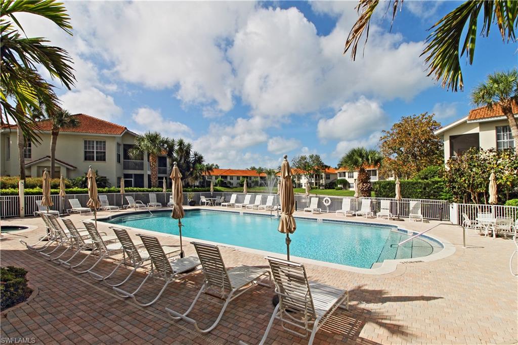 970 Egrets Run, Unit 201 Naples, FL 34108 - Photo 29 of 50 a view of a patio with swimming pool