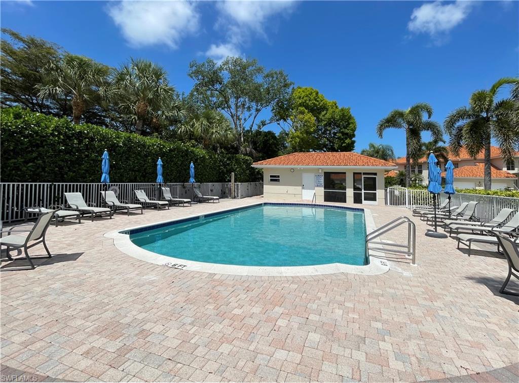 970 Egrets Run, Unit 201 Naples, FL 34108 - Photo 30 of 50 a view of a house with swimming pool and sitting area