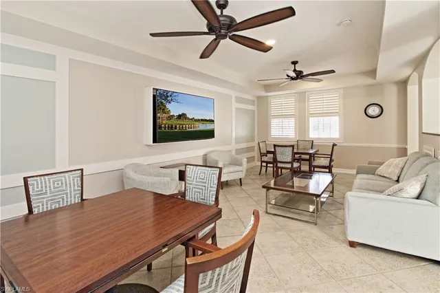 a large kitchen with granite countertop a sink a counter top space appliances and cabinets