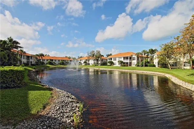 a view of a street with a house in the background