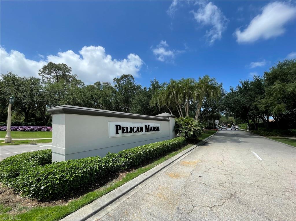 970 Egrets Run, Unit 201 Naples, FL 34108 - Photo 38 of 50 a view of a street with a house in the background
