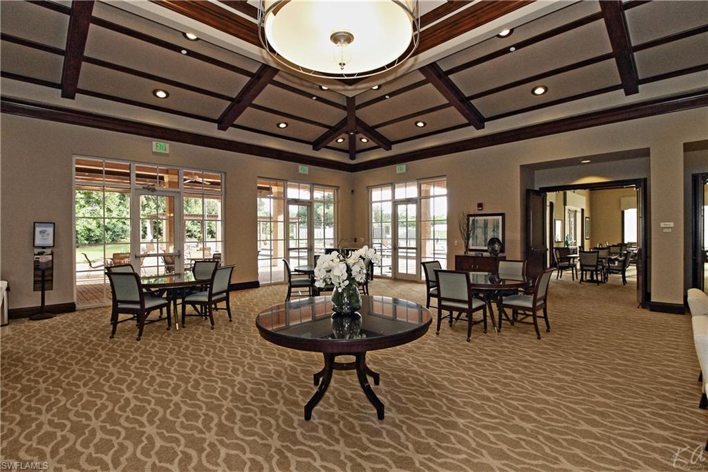 970 Egrets Run, Unit 201 Naples, FL 34108 - Photo 42 of 50 a view of a dining room with furniture window and outside view