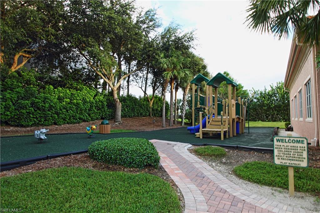 970 Egrets Run, Unit 201 Naples, FL 34108 - Photo 44 of 50 a view of a backyard with sitting area