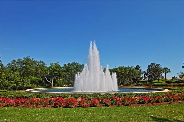 a dining hall with a table and chairs