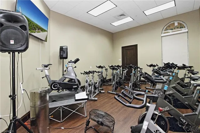 a group of lawn chairs under an umbrella